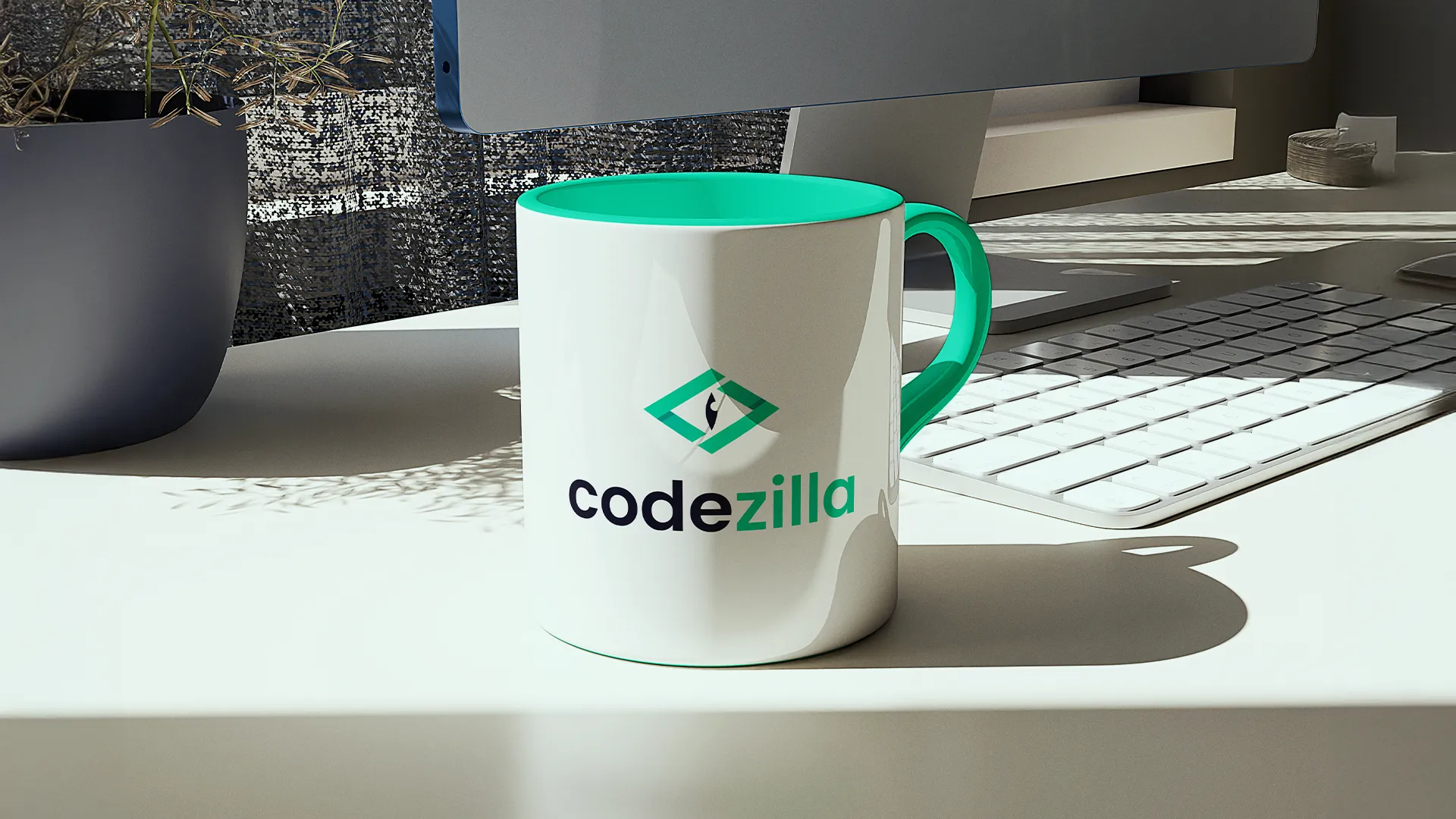 Custom Codezilla mug on a work desk next to a keyboard and monitor in a modern office space